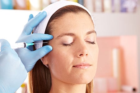 Woman getting a Botox injection